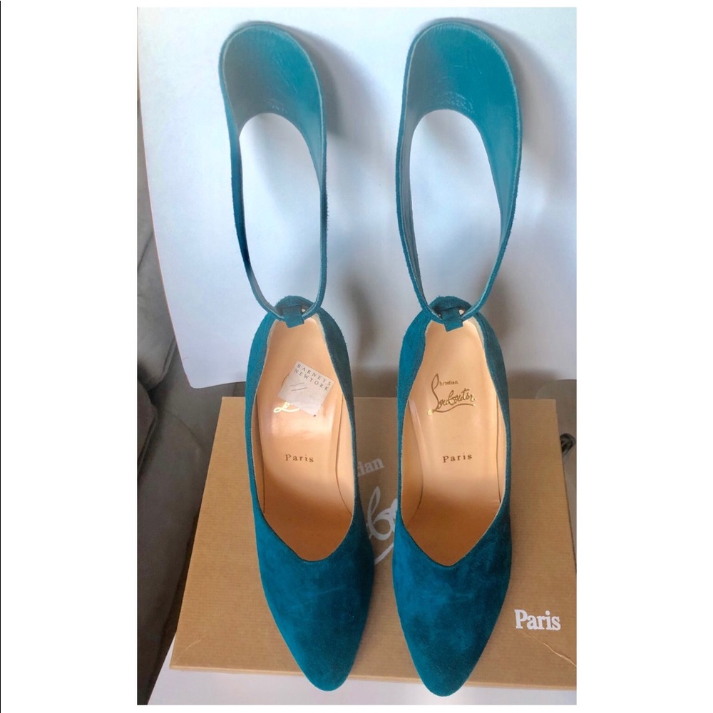 Christian Louboutin suede pumps with ankle strap.
